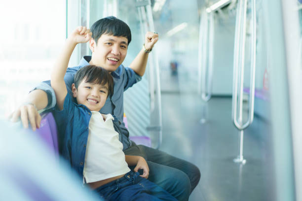 istock Asian man and son traveling on train. 2166989219