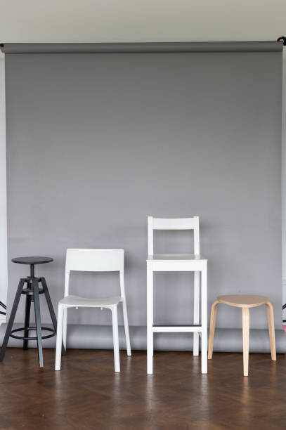 istock Modern Chairs of Various Styles Against Gray Background 2166991293