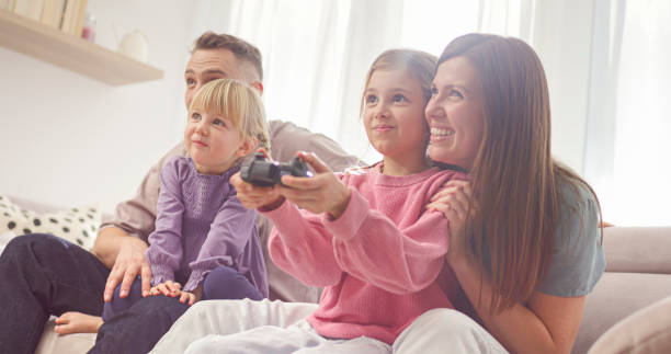 istock Family enjoying while playing video game 2166999366