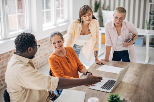 istock Business team actively brainstorming in a bright room. 2167005045