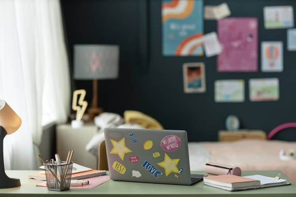 istock Decorated Home Office Desk with Stickered Laptop Open 2167005149