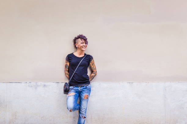 Young Woman Posing Against Wall