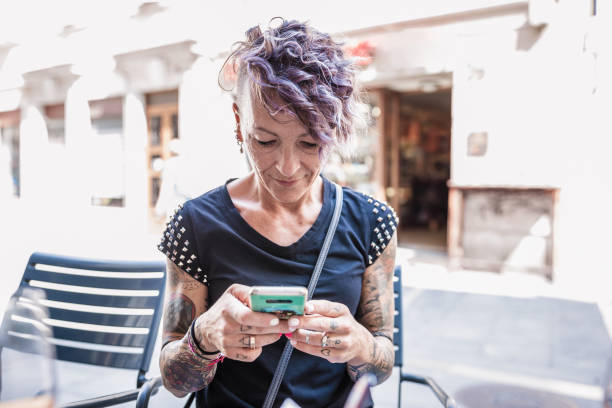 istock Trendy Woman Using Smartphone Outdoors 2167005465