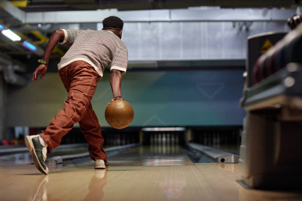 istock Bowler Release Bowling Ball in Modern Alley 2167006543