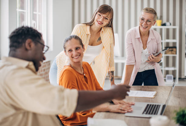 istock Colleagues discussing project details in modern office. 2167008380
