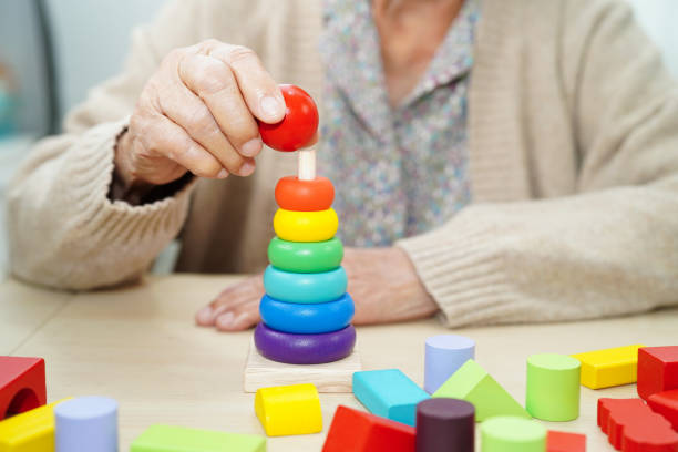 istock Asian elderly woman playing game. 2167008647