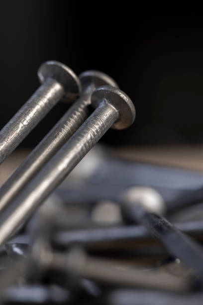 steel nails for construction work, nails made of steel for working with wooden objects, close up