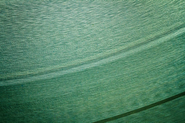 Macro shot of cyan vinyl record. Surface of an old vinyl record. Shallow depth of field.