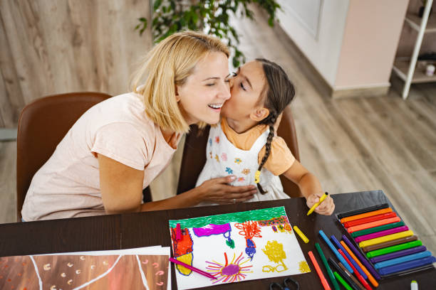 istock Mom and daughter joyfully creating art together 2167013386