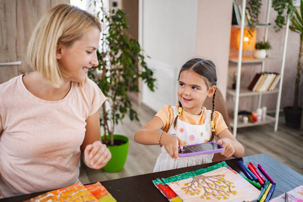 istock Mother and daughter capture creativity at the kitchen table 2167013401