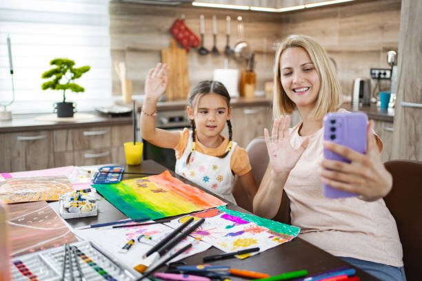 istock Mother and daughter share art and joy during a video call 2167013513