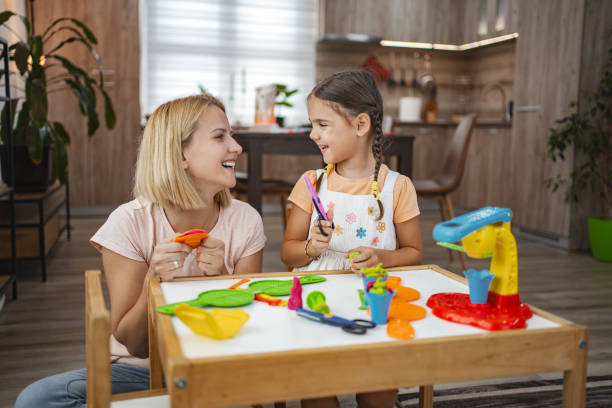 istock Mom and daughter have fun modeling in the cozy kitchen 2167013519