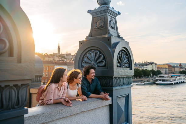 istock Three Friends Looking At View From The Chain Bridge In Budapest In Hungary 2167015080
