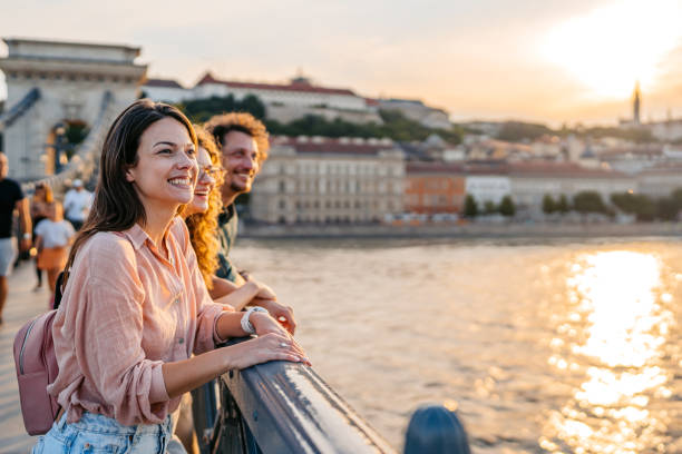 istock Three Friends Looking At View From The Chain Bridge In Budapest In Hungary 2167015708