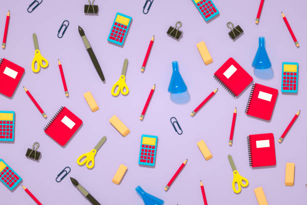 istock School Supplies on Lilac Background, Back to School Concept 2167015742