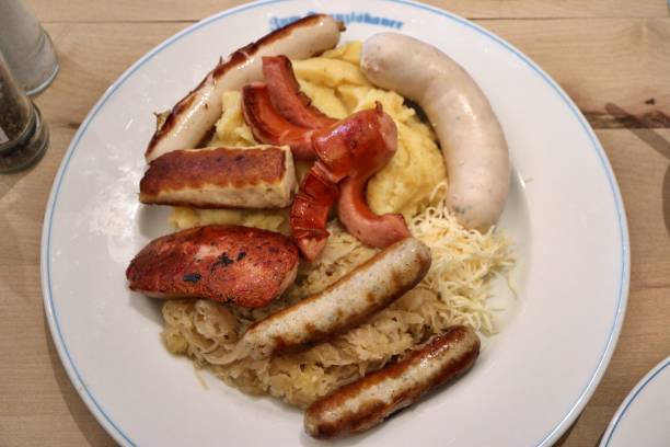 istock German cuisine: bratwurst (grilled pork sausages), mashed potatoes and sauerkraut (sour cabbage) in Munich, Germany 2167016077