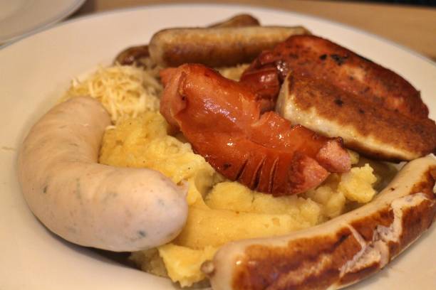 istock German cuisine: bratwurst (grilled pork sausages), mashed potatoes and sauerkraut (sour cabbage) in Munich, Germany 2167016081