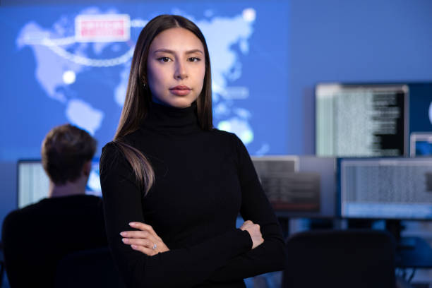 istock Serious Female Cybersecurity Analyst or Manager in large Cyber Security Operations Center SOC handling Threats 2167017118