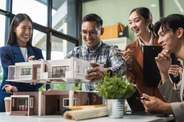 istock Engineer Teamwork Meeting, Drawing working on blueprint meeting for project working with partner on model building at company office. Asian industry professional team 2167019997