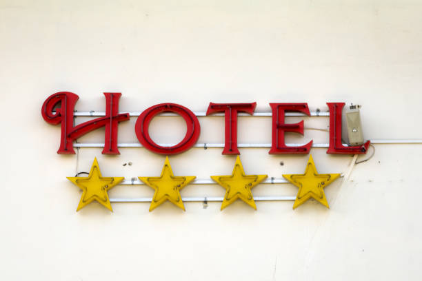 Old four star hotel sign on a building