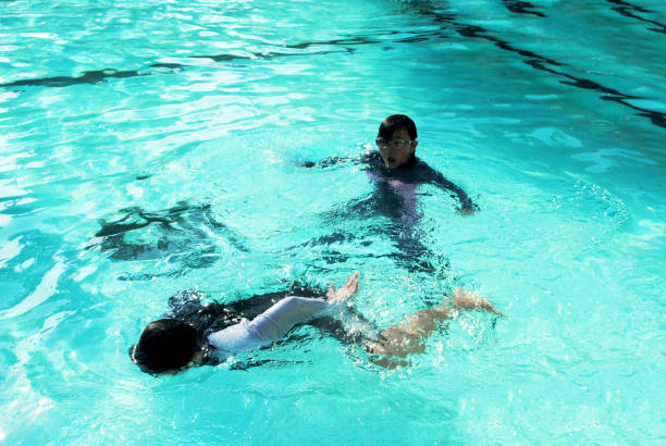 istock Having fun in the swimming pool. 2167023286