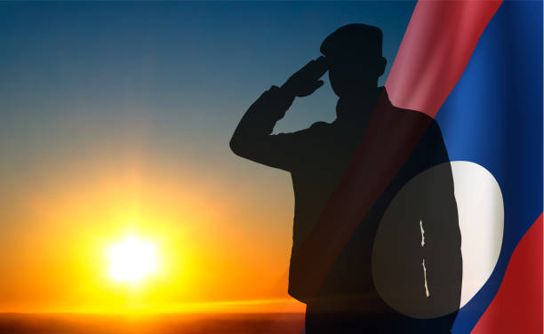 istock Silhouette of a soldier with Laos flag against the sunset 2167023391