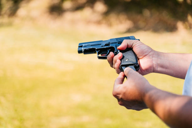 istock Mid-adult Man Reloading His Handgun Before Shooting 2167023998
