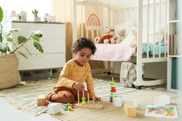 istock Playing with Educational Toys in Child's Bright Room 2167025962