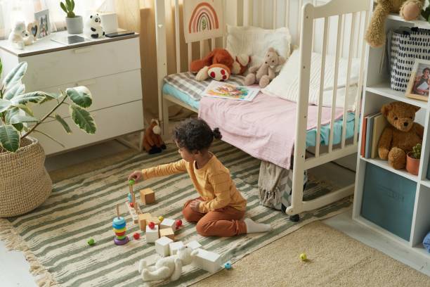 Child Playing with Blocks in Cozy Bedroom