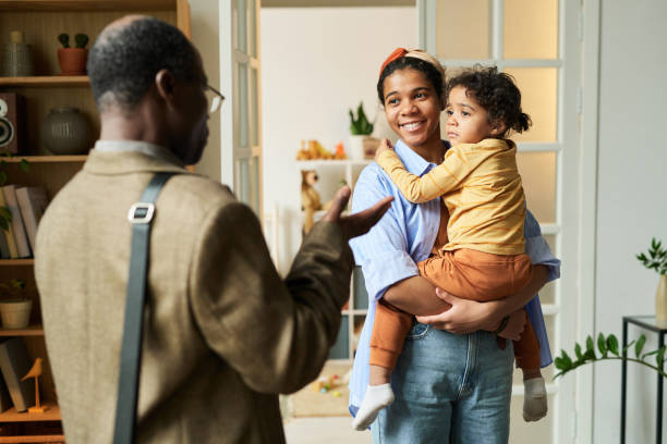 istock Greeting Returning Parent with Joyful Smiles and Hugs 2167026034