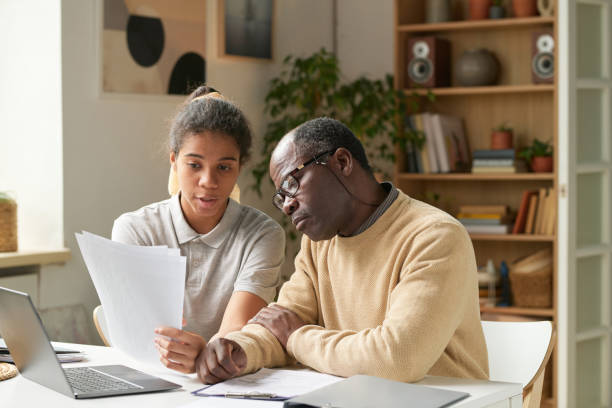 istock Concentrating Senior and Young Women Reviewing Documents 2167026066