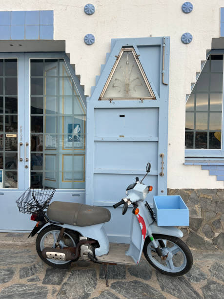 istock Blue scooter in front of a blue door 2167026197