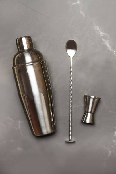 istock Cocktail utensils on a gray marble kitchen countertop with copy space 2167026742