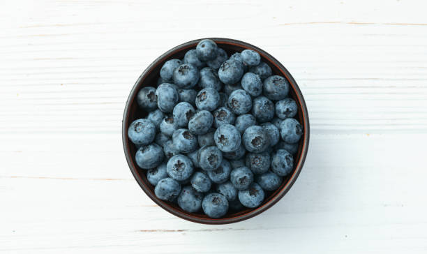 istock Blueberry photography in a bowl on rustic background 2167028063
