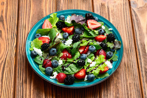 istock Berries salad (blueberry strawberry blackberry ) with cheese feta and balsamic sauce 2167028066