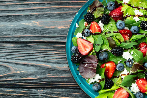 istock Berries salad (blueberry strawberry blackberry ) with cheese feta and balsamic sauce 2167028070