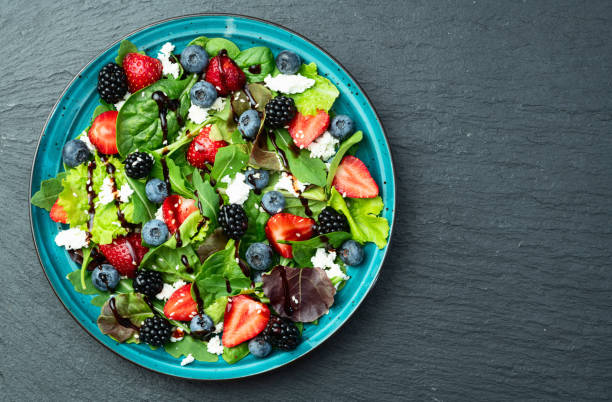 istock Berries salad (blueberry strawberry blackberry ) with cheese feta and balsamic sauce 2167028071