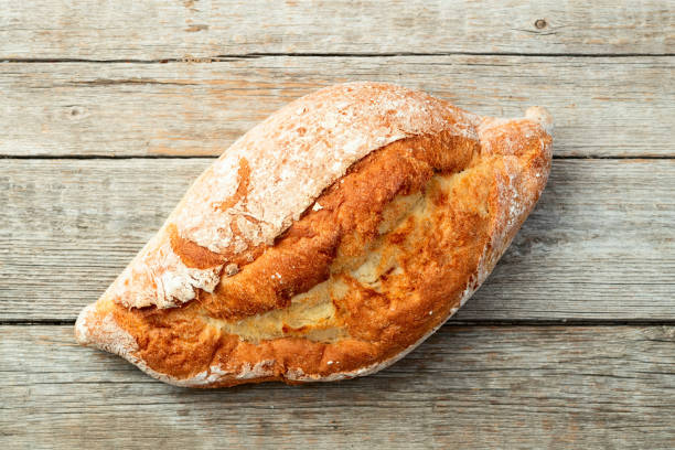istock Loaf of  wheat hearth bread . Top view 2167028115