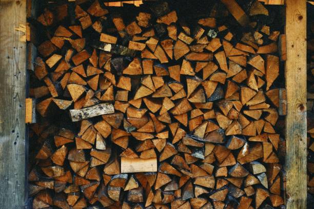 Beautiful stacked wood in a shed\nfirewood for the winter. Nicely stacked up.