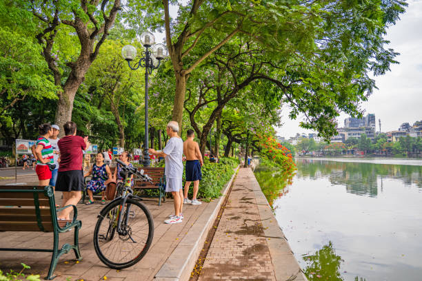 Hoan Kiem lake or Sword lake, Ho Guom in Hanoi, Vietnam with Turtle Tower, on clear day with blue sky and white clouds Hanoi, Vietnam - 26 June 2024 : Hoan Kiem lake or Sword lake, Ho Guom in Hanoi, Vietnam with Turtle Tower, on clear day with blue sky and white clouds ho guom stock pictures, royalty-free photos & images