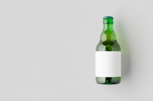 istock Green steinie beer bottle mockup with a blank label and copyspace. 2167035124