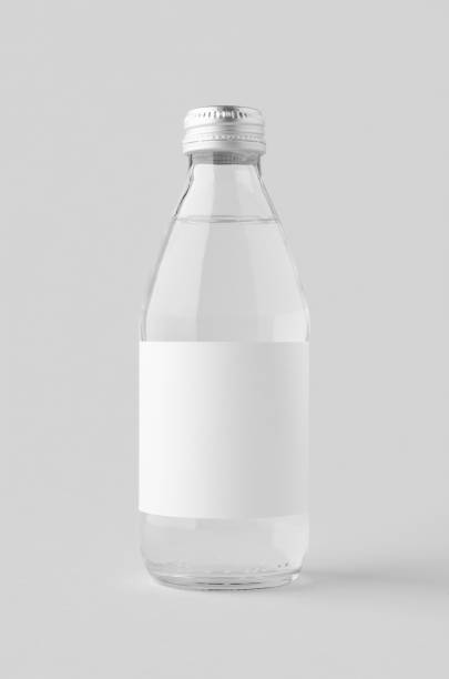 istock Small water bottle mockup with blank label. Clear glass. 2167035818