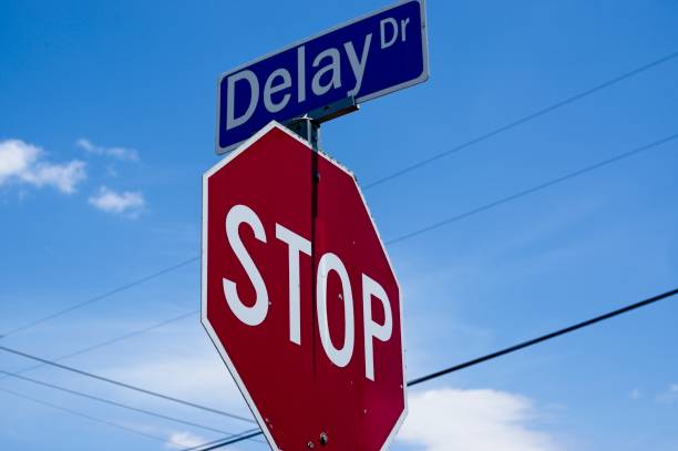 istock Street sign atop a Stop sign 2167036582