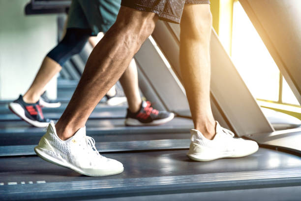istock Men exercise on the treadmill in the gym. 2167037435