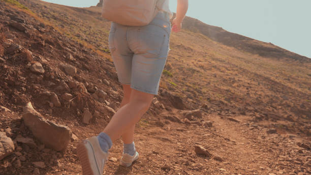 istock Young woman hikes mountain pathway, Madeira 2167037589