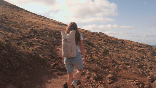 istock Young woman hikes mountain pathway, Madeira 2167037593