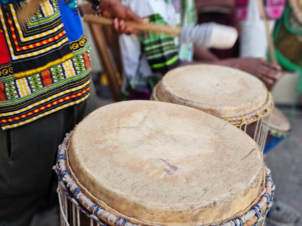 istock Drummers play traditional instruments at a cultural event in a lively outdoor setting 2167037687