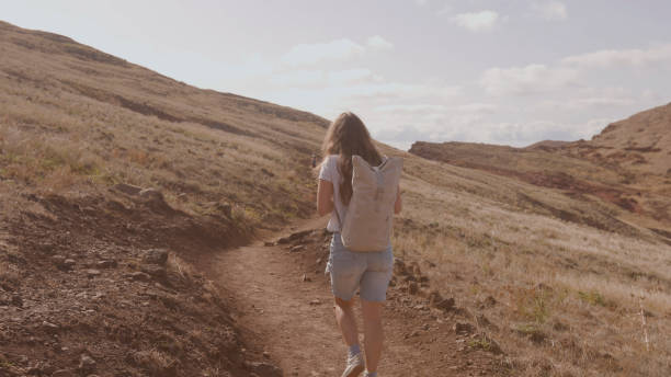 istock Young woman hikes mountain pathway, Madeira 2167037846