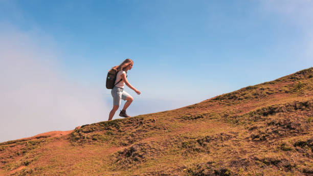 istock Young woman hikes mountain pathway, Madeira 2167038320