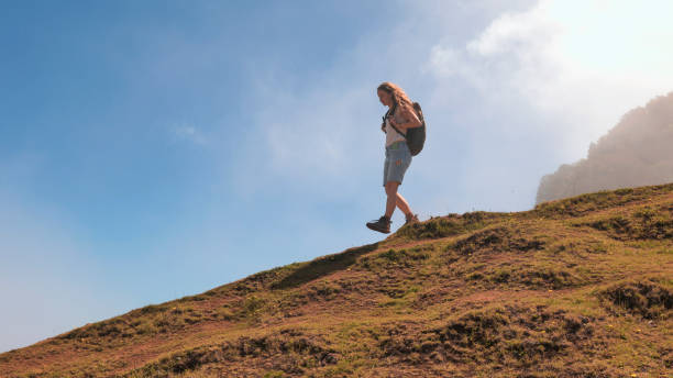 istock Young woman hikes mountain pathway, Madeira 2167038334